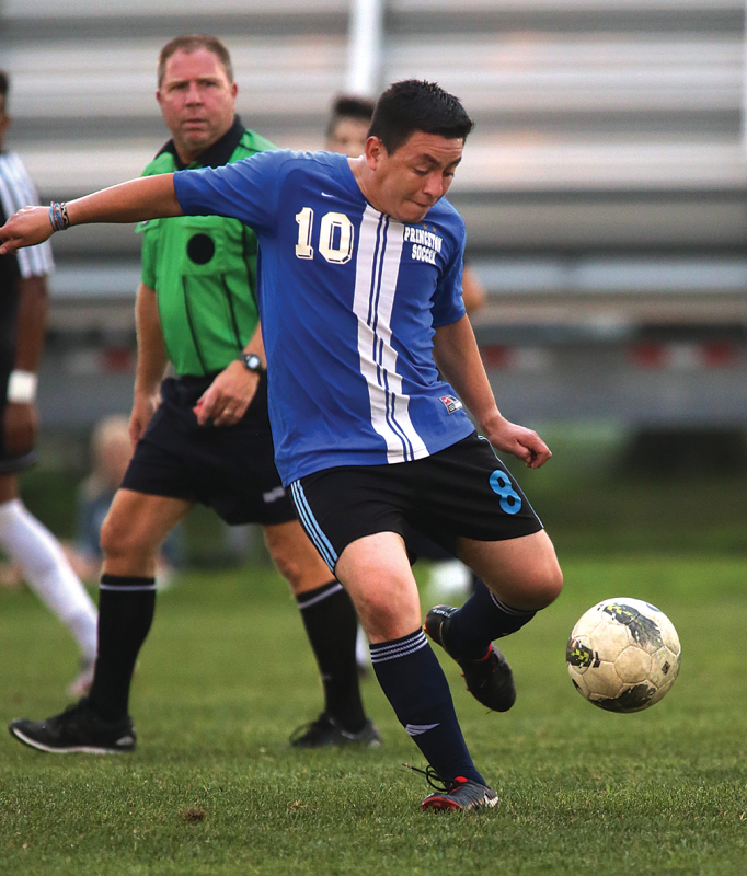 Gustavo Vega boots the   ball